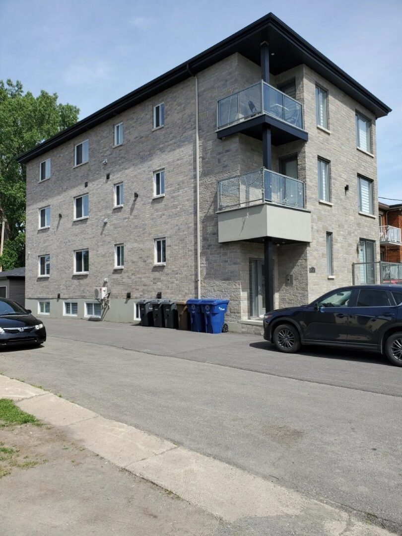 Two cars are passing nearby, a Modern Apartment